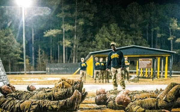 Soldiers performing drills outside at night