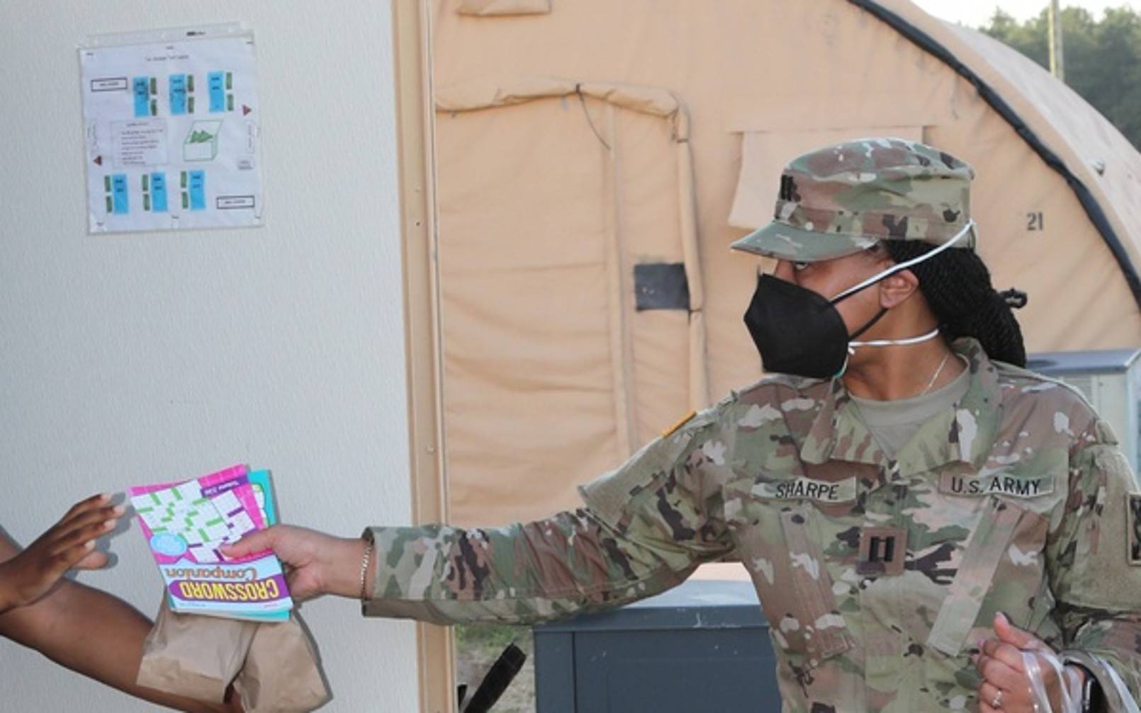 Soldiers handing out care packages