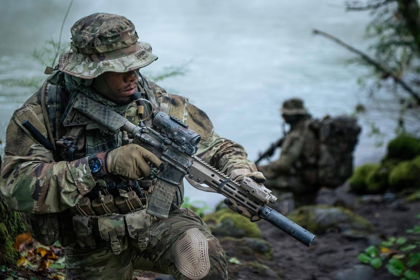 Soldiers in battle holding rifles
