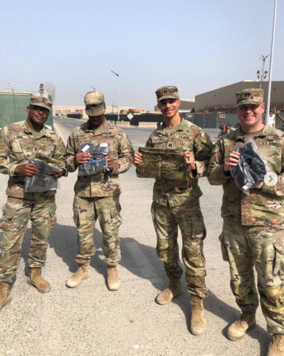 Soldiers holding care packages
